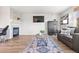 Comfortable living area featuring a fireplace, a TV and contemporary furnishings at 1788 Alpine Dr, Erie, CO 80516