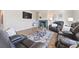 Comfortable living room with fireplace, leather seating, and large windows at 1788 Alpine Dr, Erie, CO 80516
