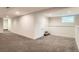 Finished basement with neutral colors, recessed lighting, and ample space for recreation at 1819 W 32Nd Ave, Denver, CO 80211