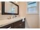 Elegant bathroom with marble countertop and modern fixtures, offering a clean and bright space at 1819 W 32Nd Ave, Denver, CO 80211