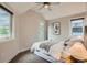 Cozy bedroom with ample natural light, a comfortable bed, and neutral decor at 1819 W 32Nd Ave, Denver, CO 80211