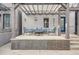 Inviting home exterior with a covered porch, seating, and a charming brick facade at 1819 W 32Nd Ave, Denver, CO 80211
