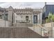 Inviting home exterior with a covered porch, seating, and a charming brick facade at 1819 W 32Nd Ave, Denver, CO 80211