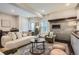 Cozy living room featuring a modern fireplace, comfortable seating, and stylish decor at 1819 W 32Nd Ave, Denver, CO 80211