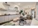 Open-concept living room featuring stylish decor and a seamless flow to the dining area at 1819 W 32Nd Ave, Denver, CO 80211