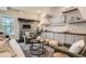 Cozy living room featuring a modern fireplace, comfortable seating, and stylish decor at 1819 W 32Nd Ave, Denver, CO 80211