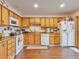 Bright kitchen with wood cabinets and access to backyard at 12246 E 2Nd Dr, Aurora, CO 80011