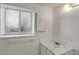 Well-lit bathroom featuring a single sink with marble countertops and white cabinet at 16651 E Arizona Pl, Aurora, CO 80017