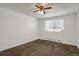 Bedroom features a ceiling fan, carpet flooring, a window, and an electrical heater at 16651 E Arizona Pl, Aurora, CO 80017