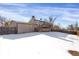 Back exterior view of house in winter at 16651 E Arizona Pl, Aurora, CO 80017