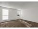 Bright living room with neutral carpeting and large windows at 16651 E Arizona Pl, Aurora, CO 80017