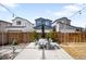 Backyard patio with table and chairs perfect for outdoor dining and entertaining at 9976 E 63Rd Ave, Denver, CO 80238