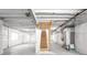 Unfinished basement with exposed ceiling and stairs at 9976 E 63Rd Ave, Denver, CO 80238