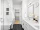 Modern bathroom featuring a walk-in shower, dual vanity, and hexagon tile floor at 9976 E 63Rd Ave, Denver, CO 80238