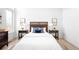 Cozy bedroom with wood accents, soft lighting, and stylish decor at 9976 E 63Rd Ave, Denver, CO 80238