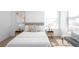 Bright bedroom featuring a large window, stylish decor, and soft, neutral tones at 9976 E 63Rd Ave, Denver, CO 80238