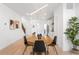 Modern dining area with stylish chandelier and an open floor plan at 9976 E 63Rd Ave, Denver, CO 80238