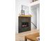 Elegant fireplace with tiled surround and decorative mantel at 9976 E 63Rd Ave, Denver, CO 80238