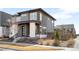 Stylish two-story home showcasing a well-manicured yard and modern architectural details at 9976 E 63Rd Ave, Denver, CO 80238