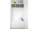 Well-organized mudroom with built-in storage and seating at 9976 E 63Rd Ave, Denver, CO 80238