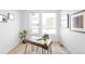 Bright home office with modern desk and large windows at 9976 E 63Rd Ave, Denver, CO 80238