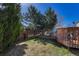 The beautiful backyard offers a deck, shed, and grassy area, creating a serene outdoor oasis at 5160 Hannibal St, Denver, CO 80239