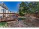 Wooden deck is the perfect place to relax while overlooking the well-maintained backyard at 5160 Hannibal St, Denver, CO 80239