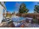 Outdoor deck with glass table and chairs provides a relaxing space to entertain or dine at 5160 Hannibal St, Denver, CO 80239