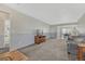 Spacious living room with neutral colors and plush carpet at 5160 Hannibal St, Denver, CO 80239