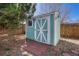 Backyard shed offering extra storage space, nestled in a well-maintained outdoor area at 5160 Hannibal St, Denver, CO 80239