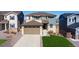 Inviting two-story home with a two car garage, well-manicured lawn, and charming curb appeal at 944 Mcmurdo Cir, Castle Rock, CO 80108