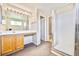 Bathroom featuring a vanity, mirror, and glass shower enclosure at 11305 W Crestline Dr, Littleton, CO 80127