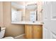 Bright bathroom with vanity, mirror, and neutral tones at 11305 W Crestline Dr, Littleton, CO 80127