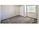 Carpeted bedroom with double closet doors at 11305 W Crestline Dr, Littleton, CO 80127