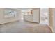 Spacious living room area with view of the kitchen, and stairs to the upper level at 11305 W Crestline Dr, Littleton, CO 80127