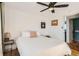 Bedroom with queen bed, ceiling fan, and access to bathroom at 4330 Bruce Randolph Ave, Denver, CO 80207