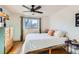 Bright bedroom with a queen bed and ceiling fan at 4330 Bruce Randolph Ave, Denver, CO 80207