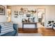 Living room with gallery wall and view into kitchen at 4330 Bruce Randolph Ave, Denver, CO 80207