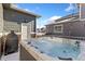 Backyard hot tub, patio and string lighting at 599 Fall River Ct, Brighton, CO 80601