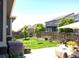 Well-maintained backyard with lush green grass, a patio, and privacy fencing at 599 Fall River Ct, Brighton, CO 80601