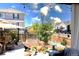 Charming backyard patio with an umbrella, plantings, and an outdoor living area at 599 Fall River Ct, Brighton, CO 80601