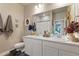 Bathroom features double sinks, ample counter space, and modern fixtures at 599 Fall River Ct, Brighton, CO 80601