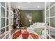 The living room has a white couch, and an eye-catching area rug in earth tones at 599 Fall River Ct, Brighton, CO 80601