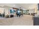 The recreation room features a flat-screen TV, a billiards table and a seating area at 599 Fall River Ct, Brighton, CO 80601
