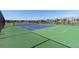 Well-maintained tennis courts with blue and green playing surfaces in a community setting at 599 Fall River Ct, Brighton, CO 80601