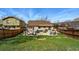 Wide backyard showcasing patio with outdoor seating and well-maintained lawn, great for entertaining at 3303 Blue Grass Cir, Castle Rock, CO 80109
