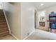 Basement hallway with stairs and a view to a bathroom and gameroom at 3303 Blue Grass Cir, Castle Rock, CO 80109