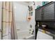 Bathroom with a shower featuring white tile, bath, and modern fixtures at 3303 Blue Grass Cir, Castle Rock, CO 80109