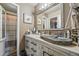 Stylish bathroom featuring a stone sink basin, unique vanity and a shower at 3303 Blue Grass Cir, Castle Rock, CO 80109