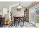 Open dining area featuring hardwood floors, modern lighting, and stylish furniture at 3303 Blue Grass Cir, Castle Rock, CO 80109
